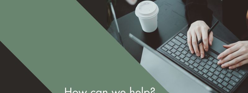 Person sat at desk on computer, looking for jobs. Featured on XCL Group website