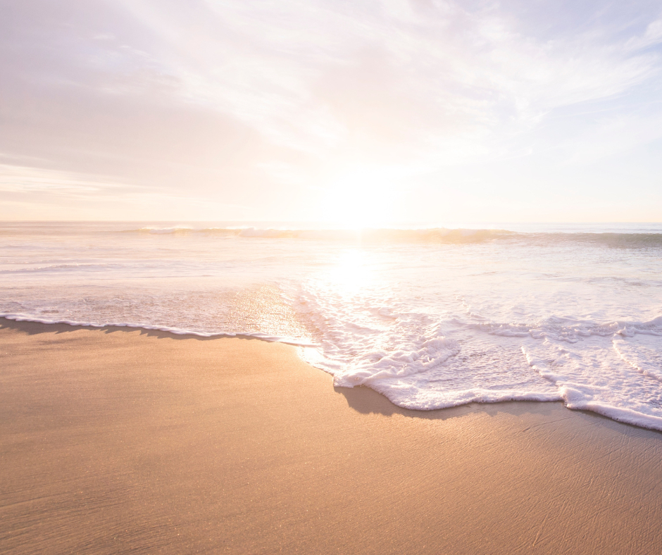 Waves on the sandy beach, sunsetting. Featured on XCL group website